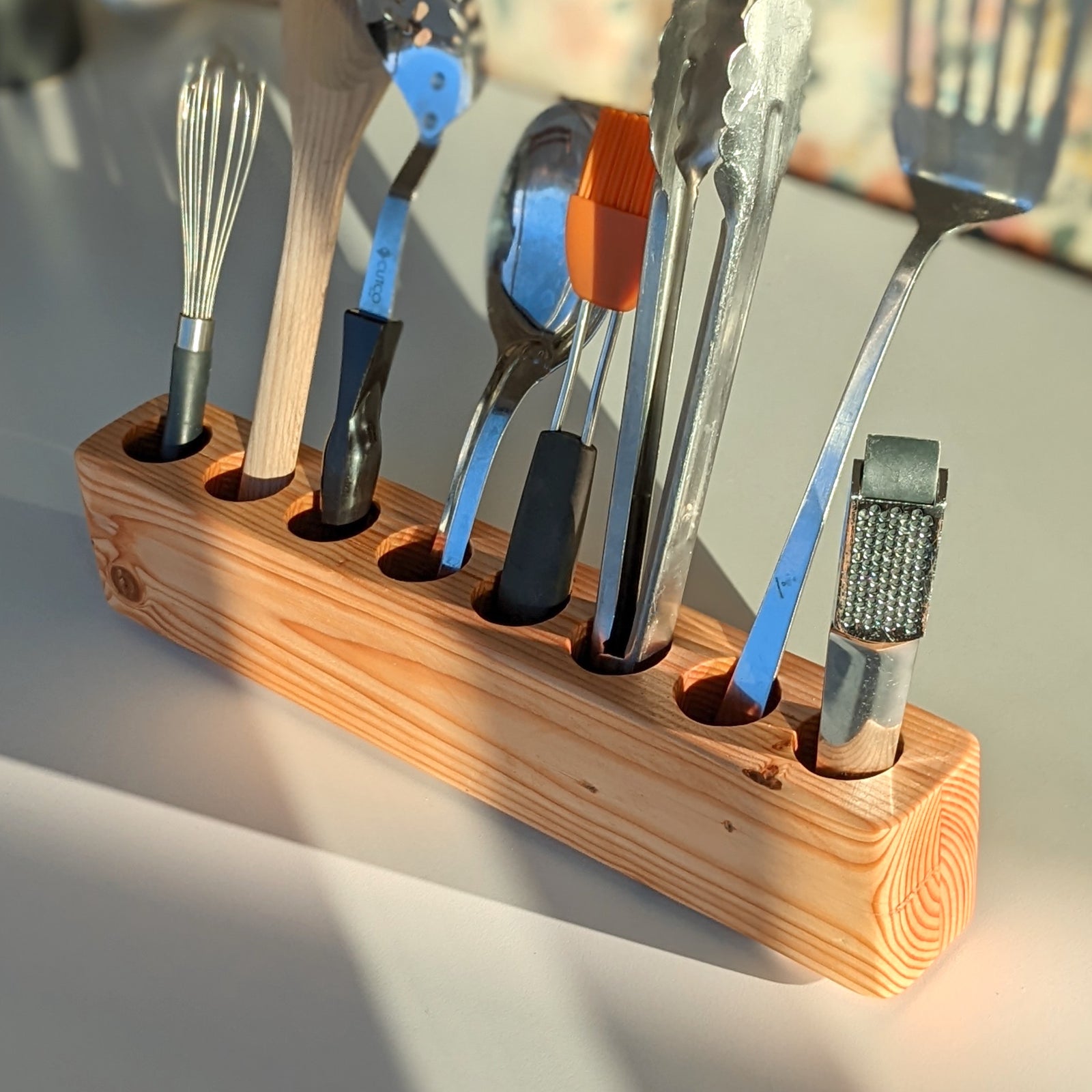 Slot cooking utensil holder